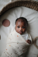 Load image into Gallery viewer, Mushie Organic Muslin Swaddle - Dinosaurs